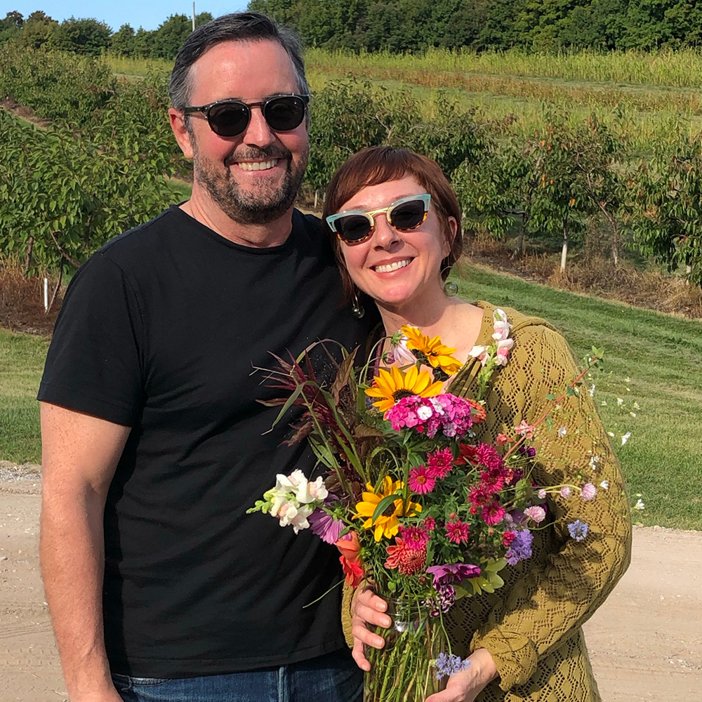 couple with bouquet of flowers